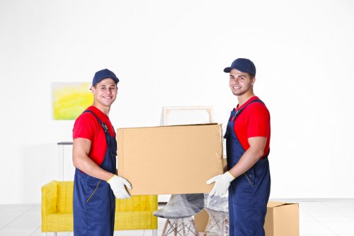 Professional removal company team loading a van in Guildford