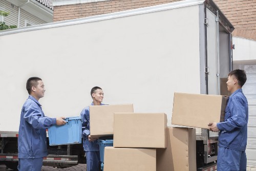 Professional furniture removal service in Guildford preparing household items for transport