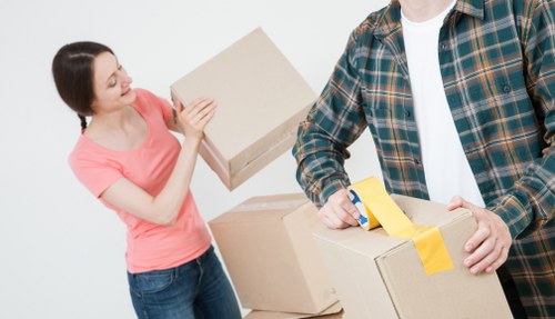 Office relocation planning in Guildford with organised moving boxes and workplace setup