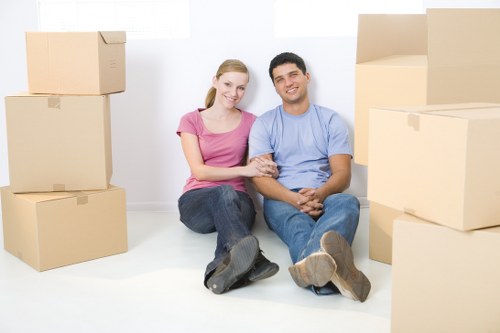 Professional office movers in Guildford handling desks and equipment during a commercial move
