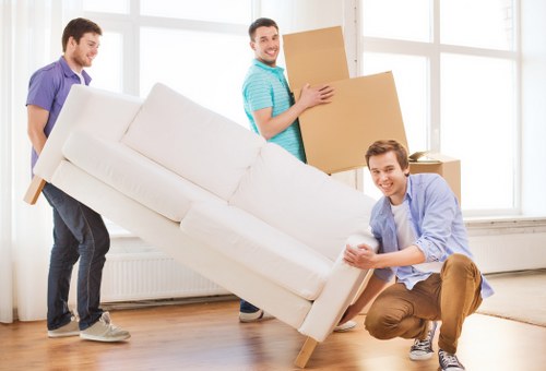 Professional team handling piano removals in Guildford