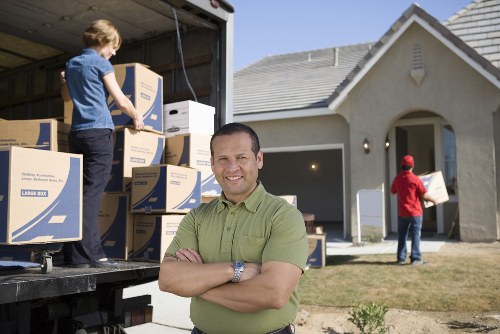 Packed boxes and organized checklist for house removals in Guildford