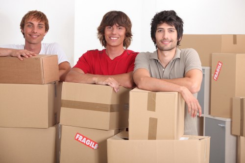 A moving van and packed boxes outside a Guildford home