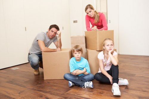 Business relocation team coordinating an office move in Guildford with labeled items and logistics