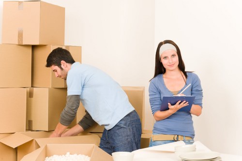 Moving crew transporting boxes during a removal service