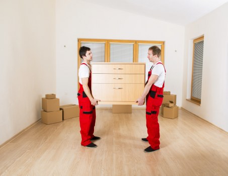 Organized moving boxes ready for a house relocation in Guildford