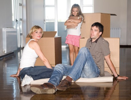 Professional movers handling furniture during a Guildford house move